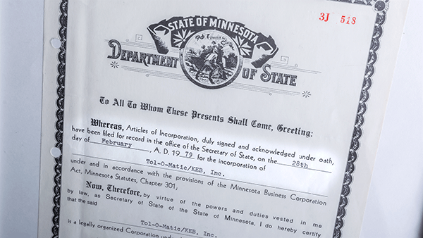 Picture of Tol-O-Matic and KEB State of Minnesota Incorporation document.