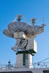 picture of satellite antennas on a naval ship